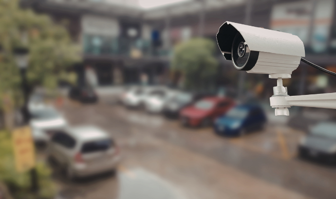 Surveillance camera in a parking lot | MAS Law